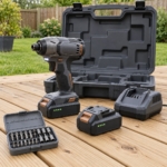18V cordless impact driver kit with batteries, charger, bit box and case on garden decking