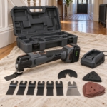 18V cordless oscillating multi-tool kit with blades, sanding pad and case on a dust sheet in a hallway